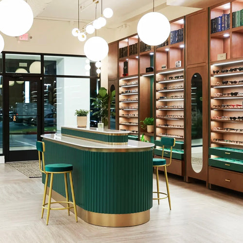 Optical shop with green deco style counter